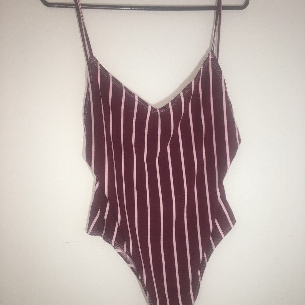 Cute backless body suit NEVER WORN